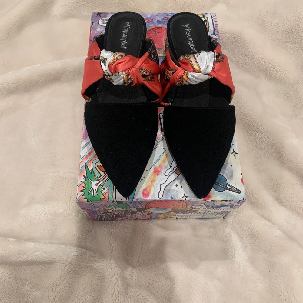 Black Suede and multi color fabric.